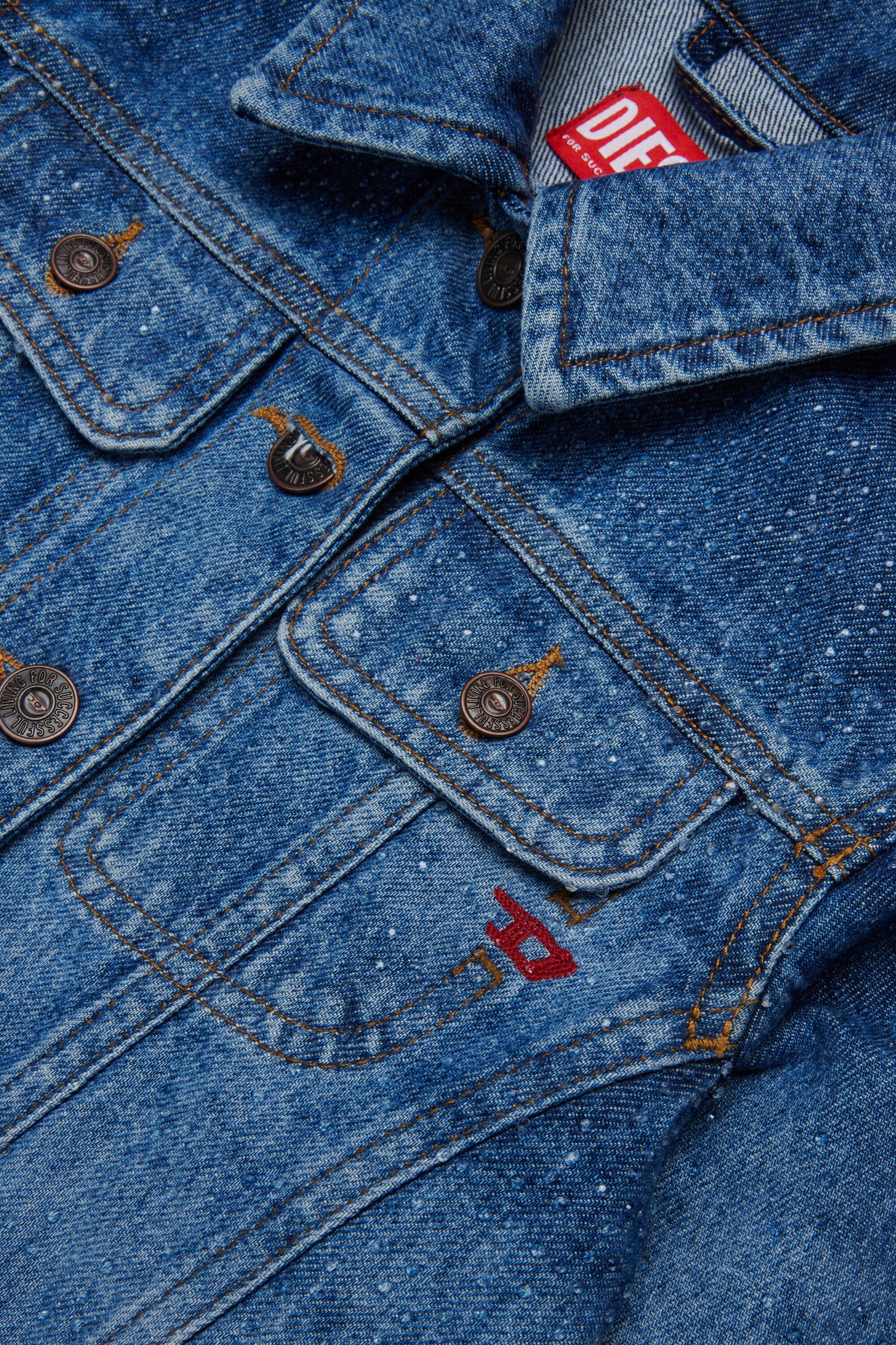 Jeans jacket with laser graphics and hotfixes