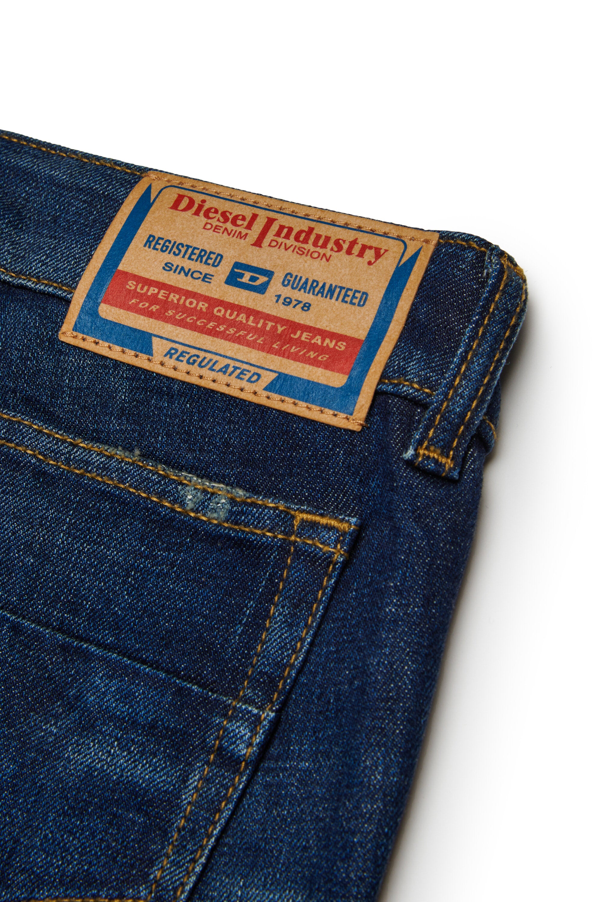 擦り傷のある濃紺のブーツカットジーンズ - D-Eki