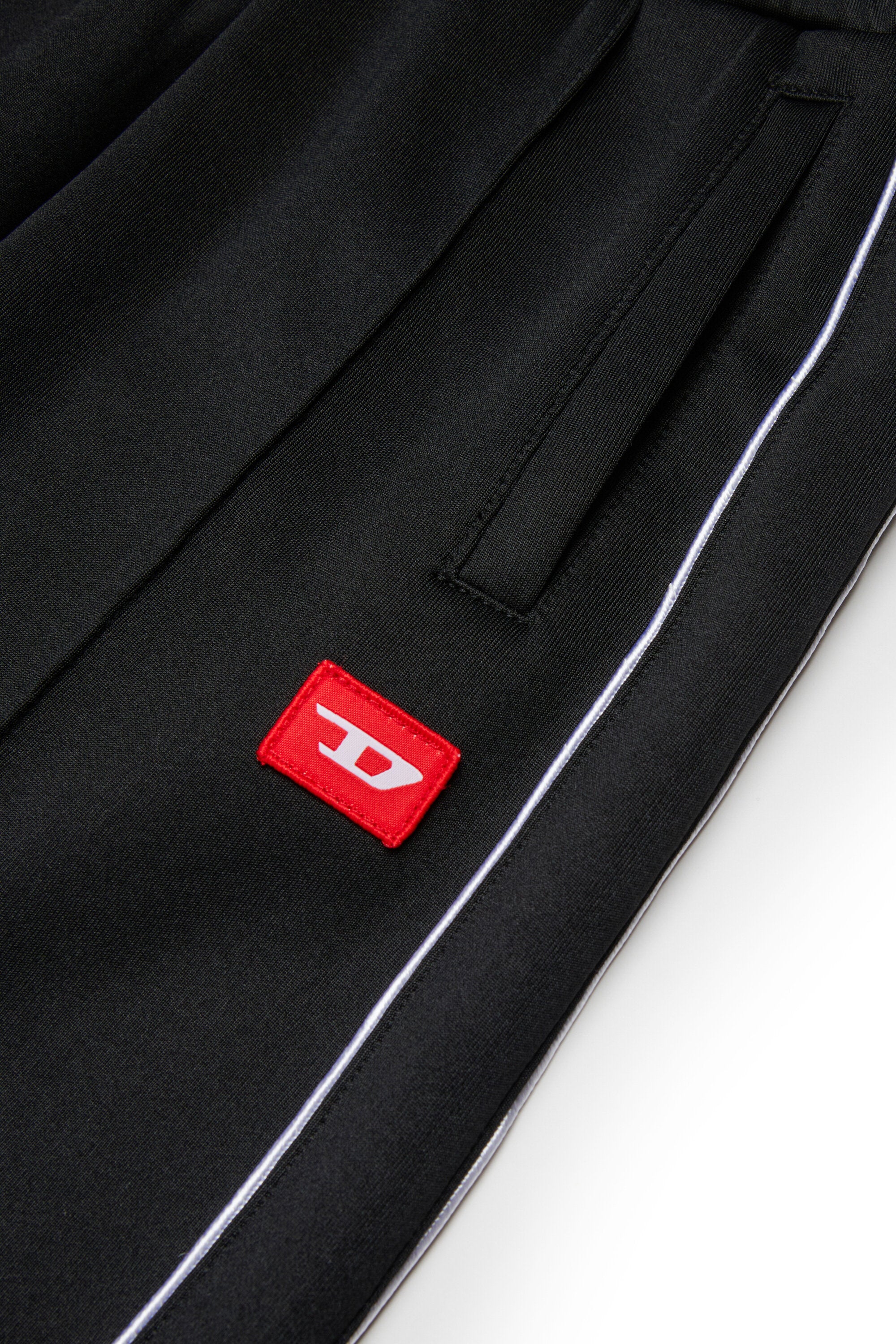 Triacetate balloon pants with red D patch