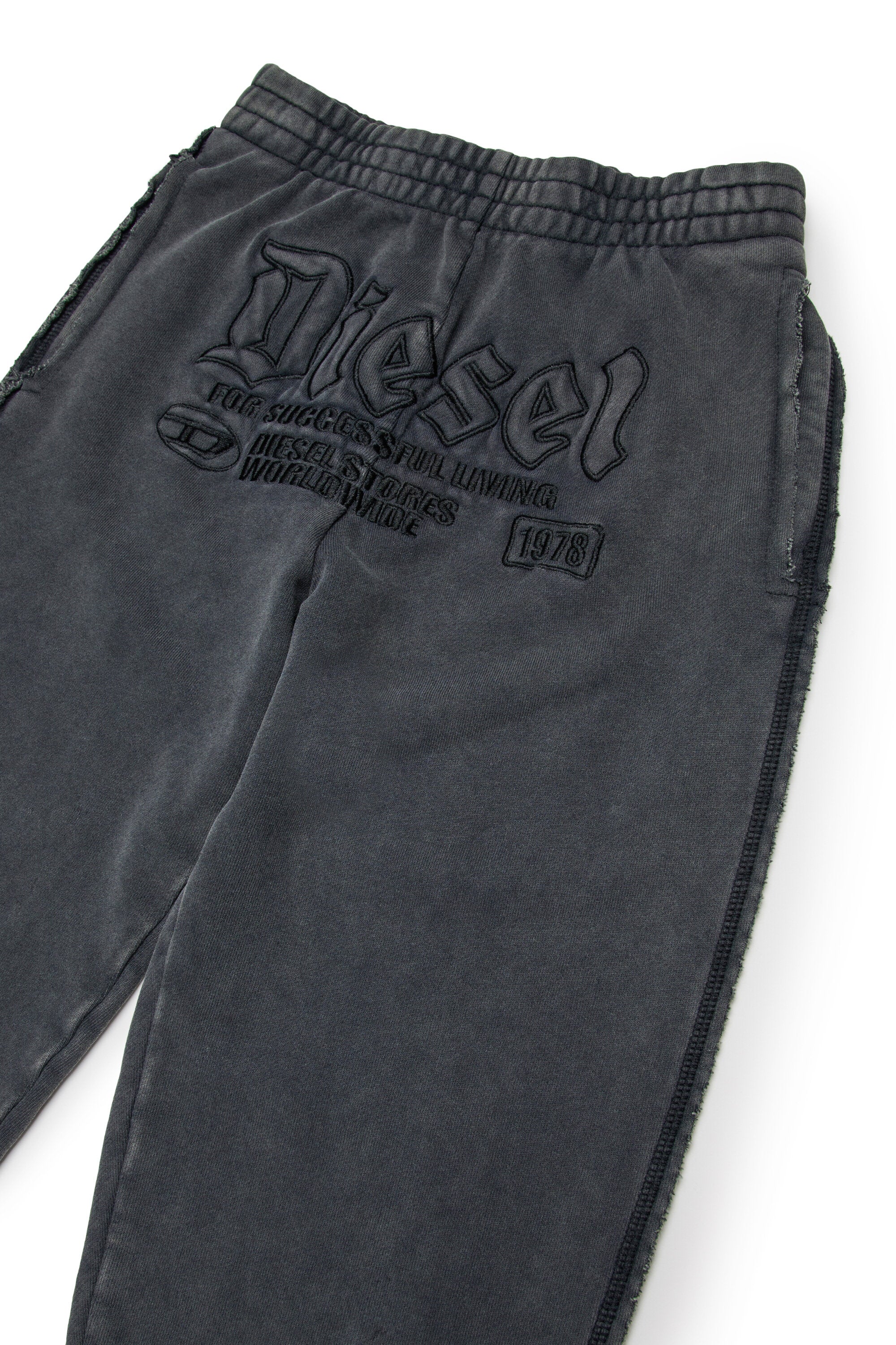 Jogger pants with gothic graphics