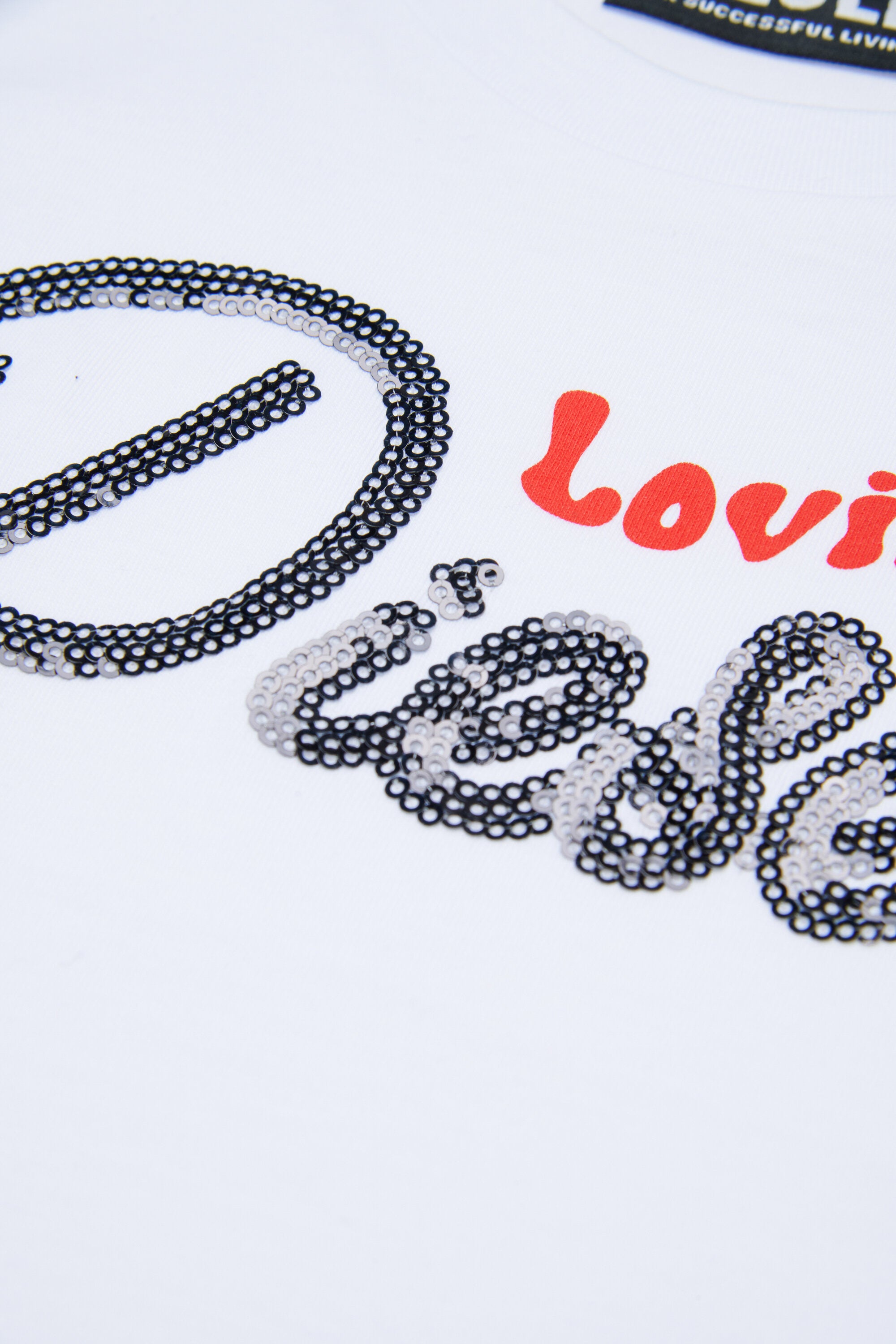 ロゴ入りTシャツ