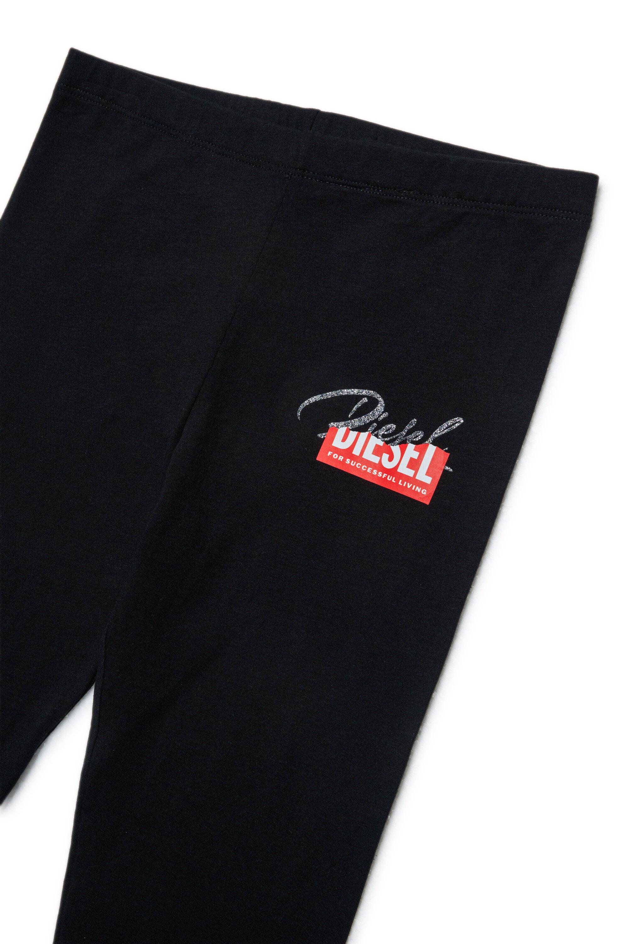 ロゴ入りジャンプスーツ