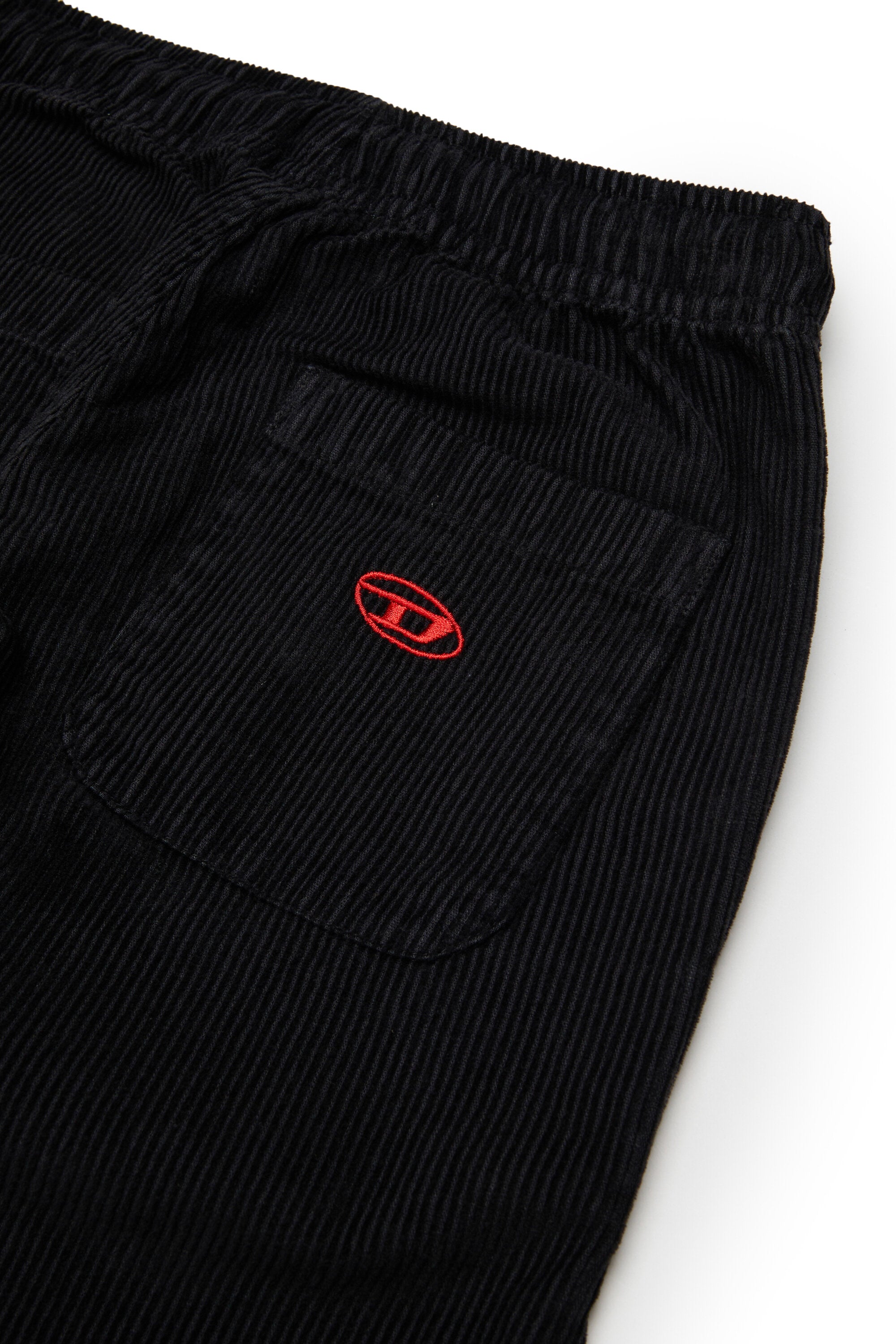 Corduroy pants with logo