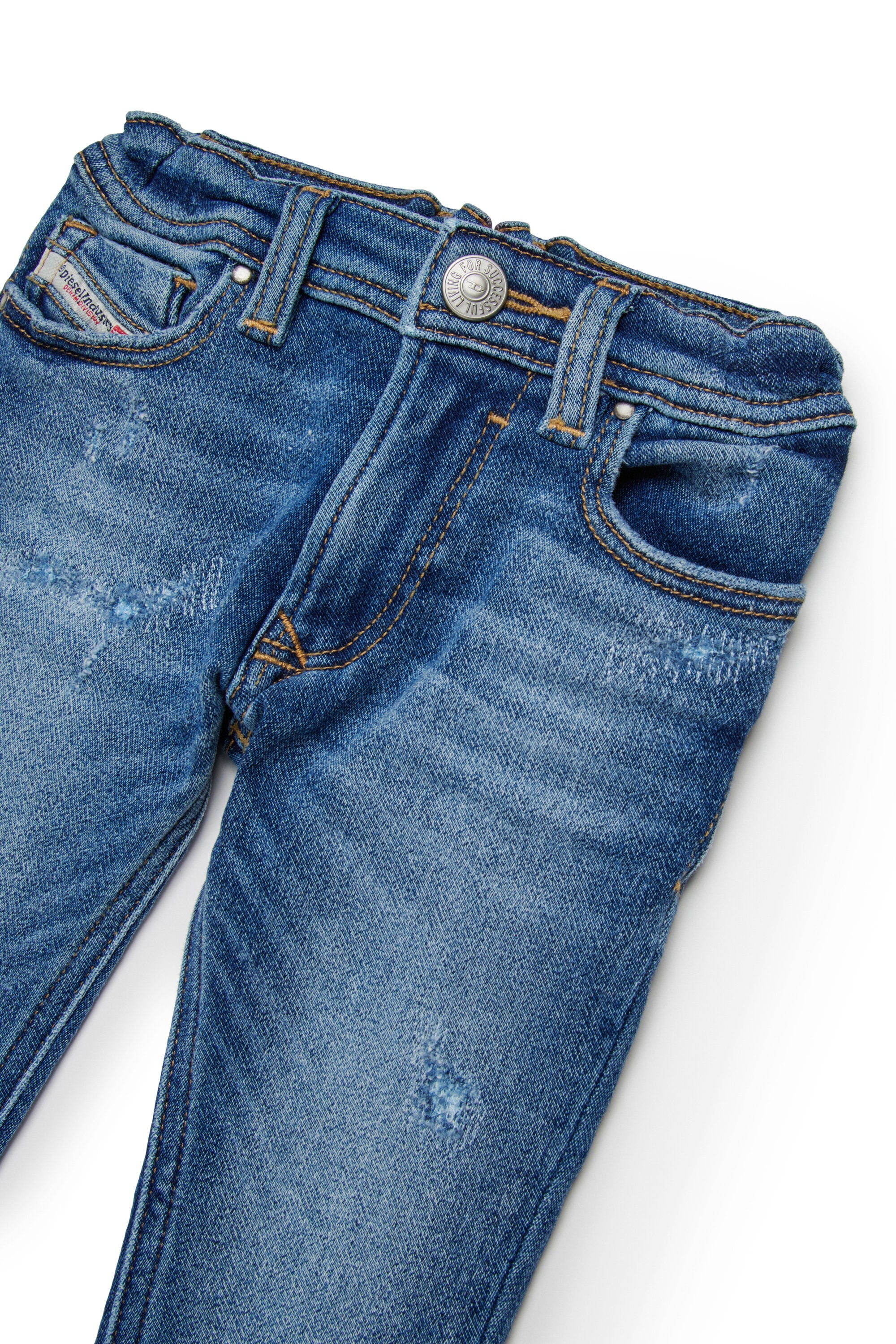 擦り切れのあるJoggJeans® (ミディアムブルースキニー) - D-Slinkie-B