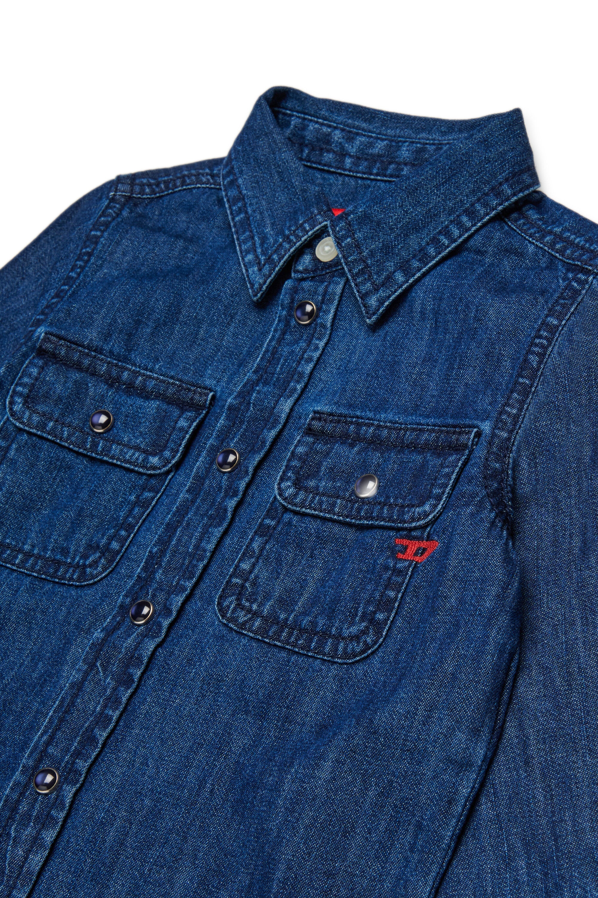 Light blue denim shirt with embroidered D