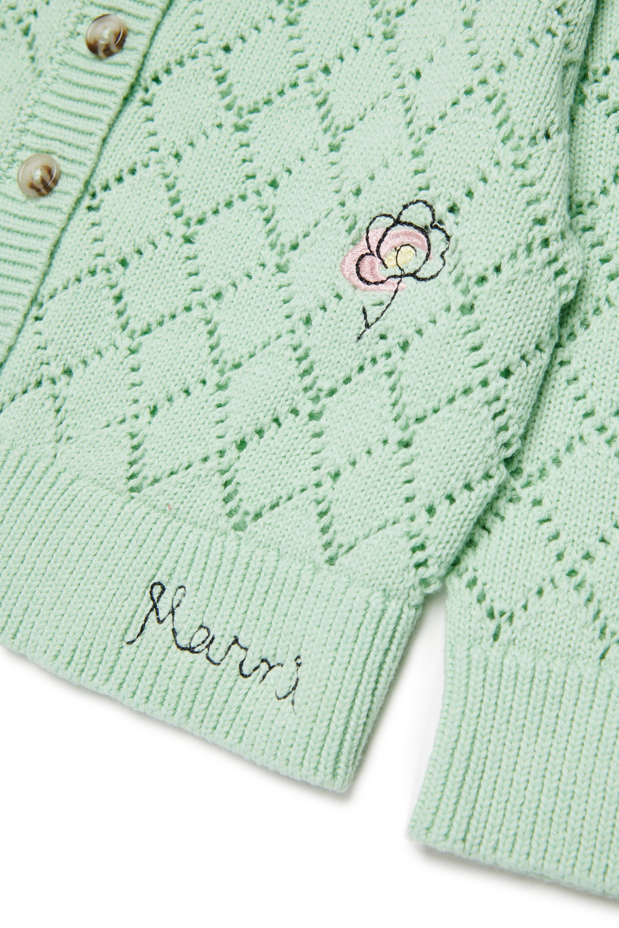 フローラル刺繍入りの透かし編みカーディガン