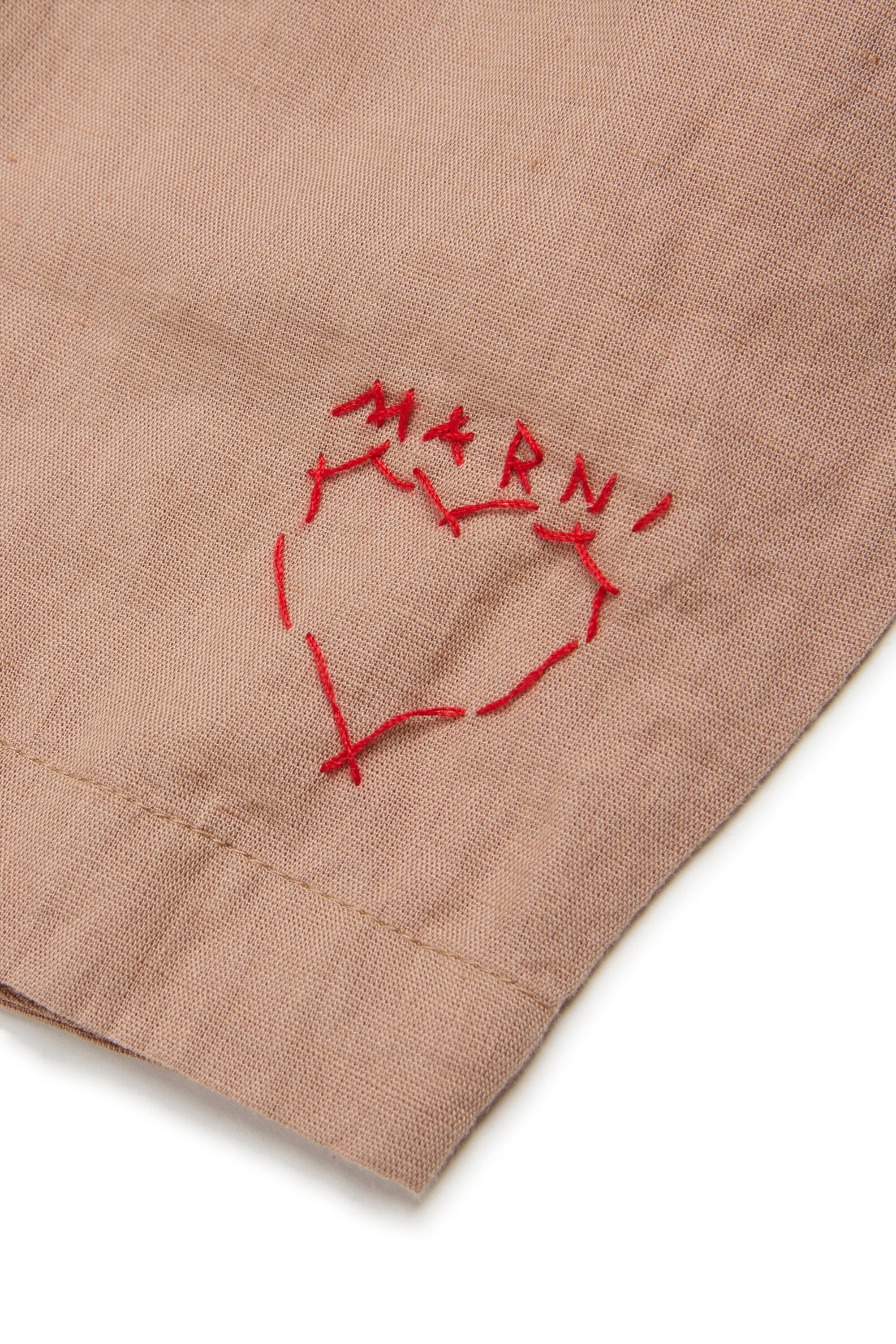 Trousers with embroidered logo