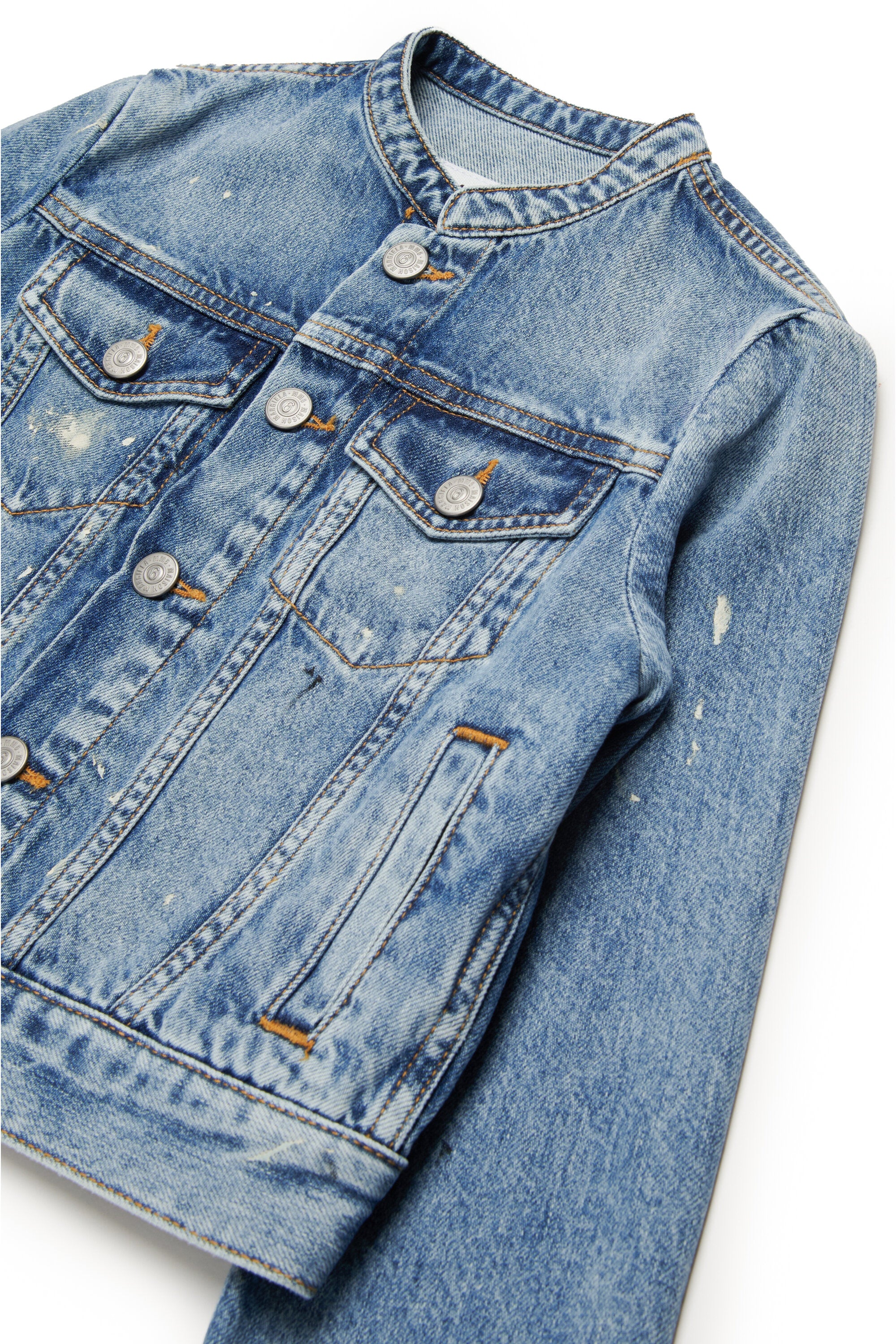 Shaded blue denim jacket with color spots