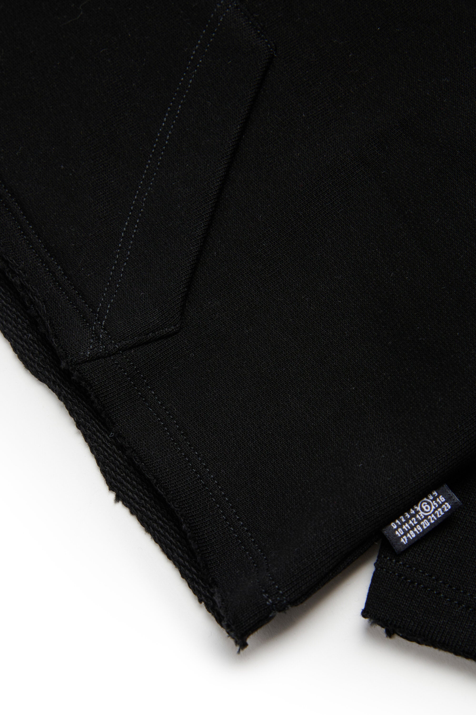 Hooded sweatshirt with raw cut hem