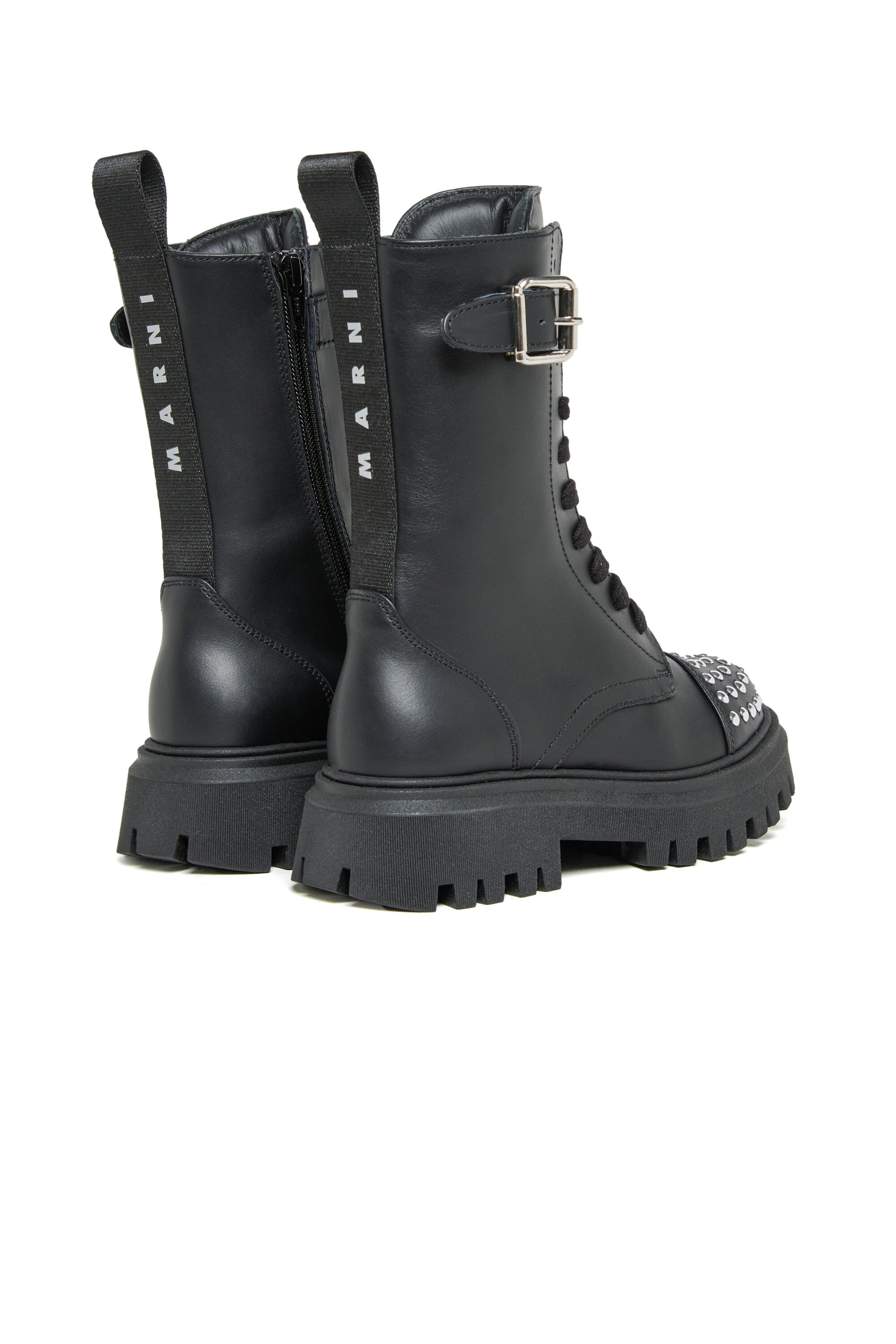 Combat boots with studs on the toe