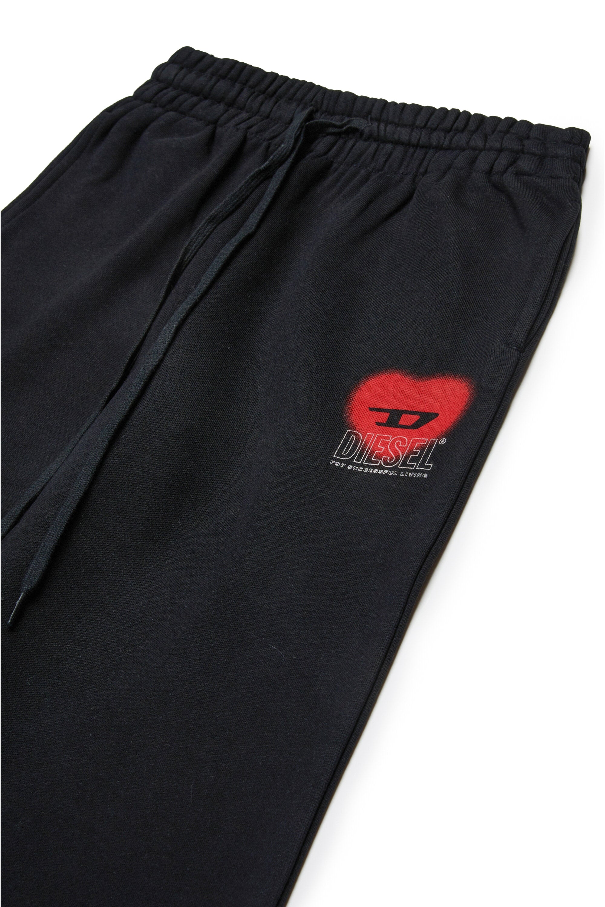 Fleece pants with heart graphics