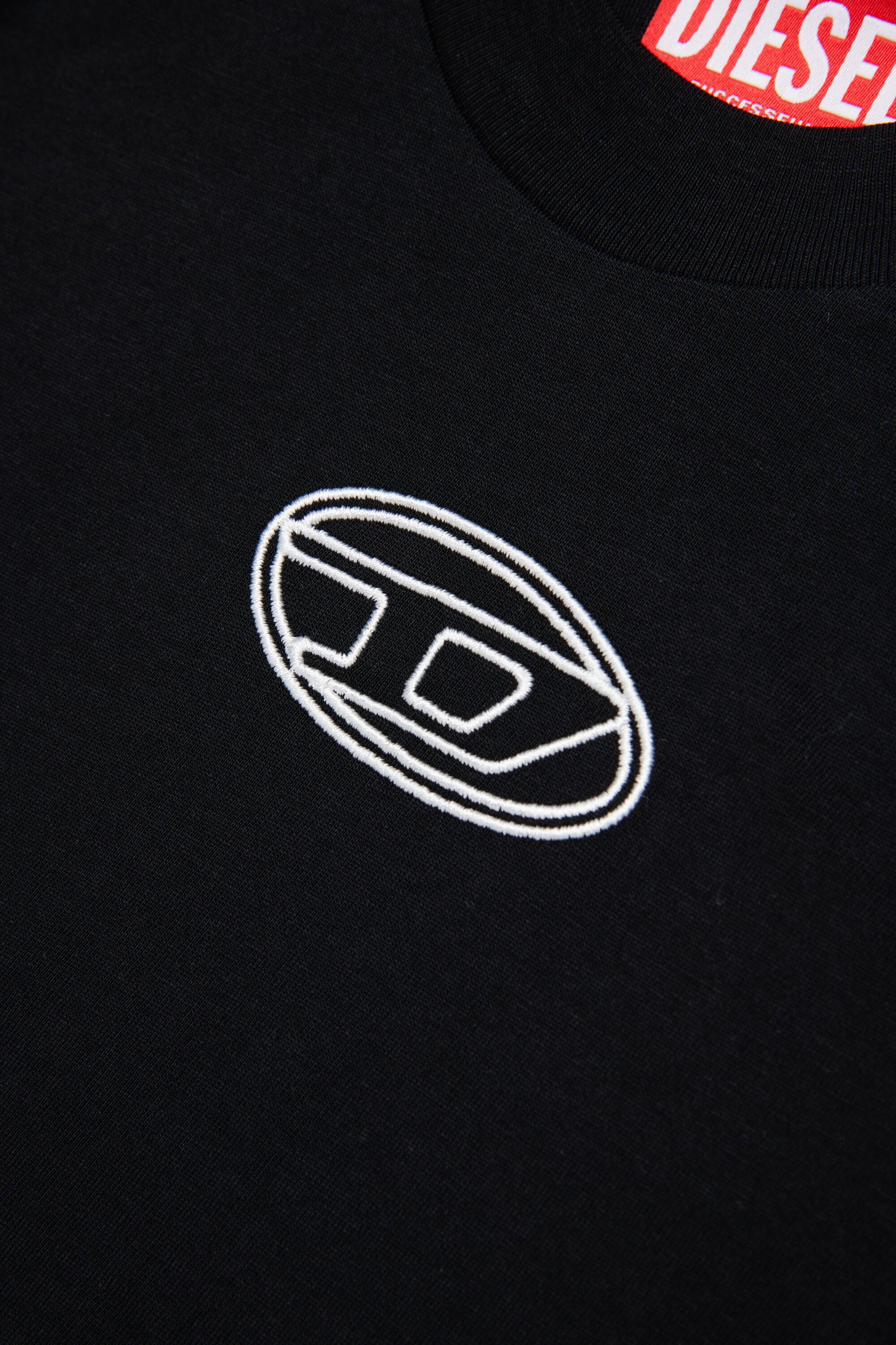 オーバルDのロゴが入ったボクシーなジャージー素材Tシャツ