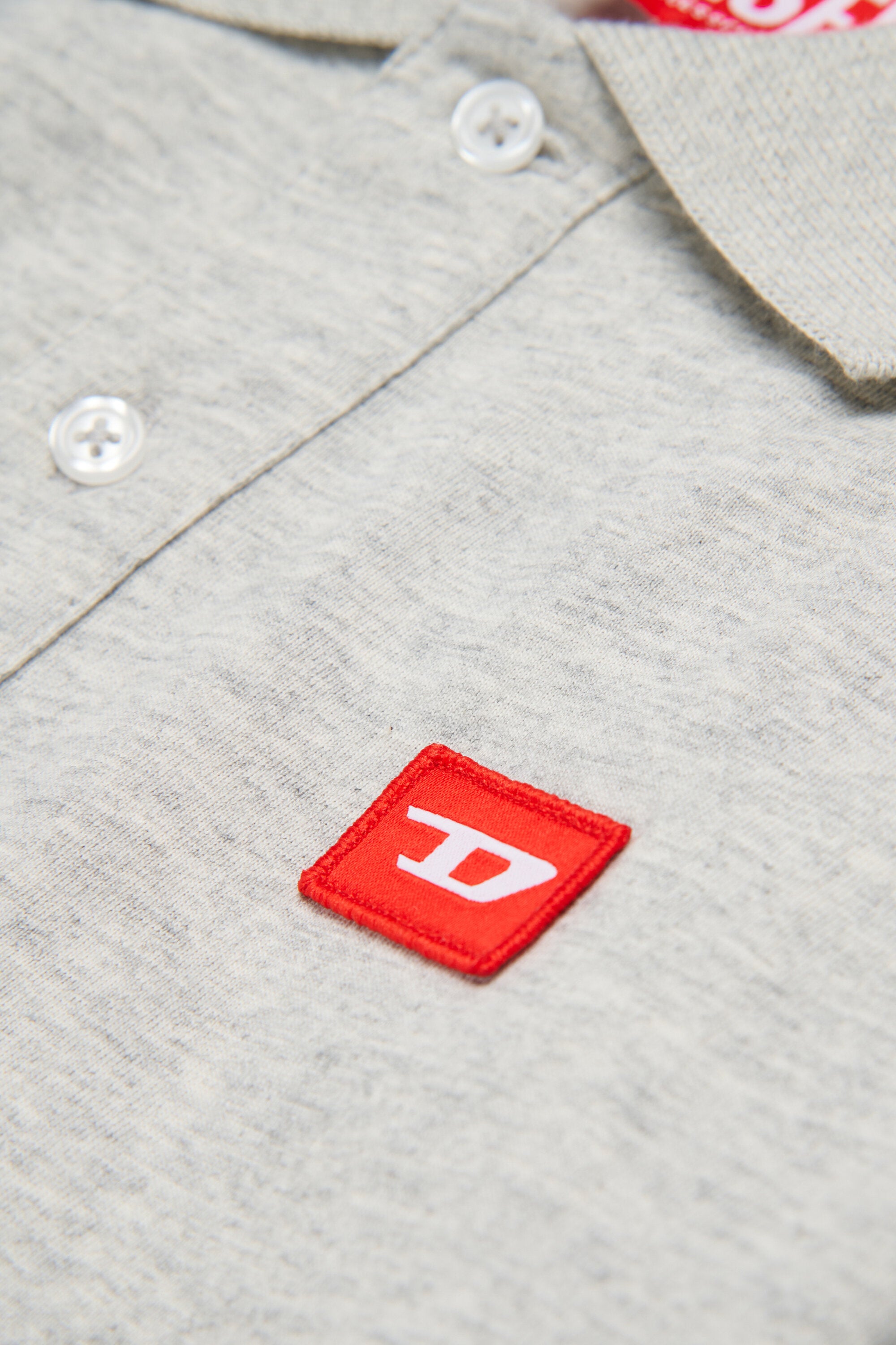 Jersey polo shirt with red D patch