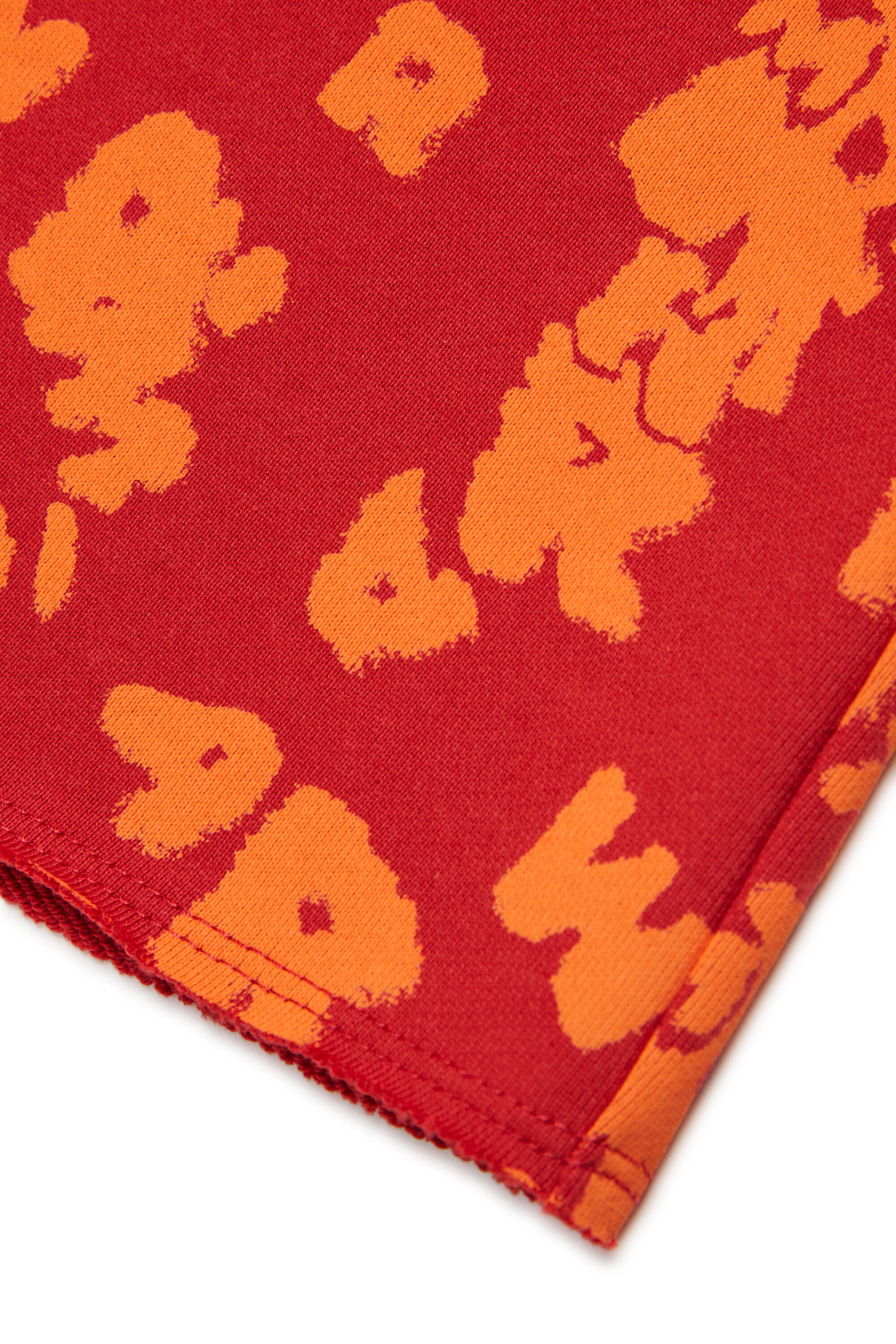 オールオーバーロゴ入りスウェットショーツ