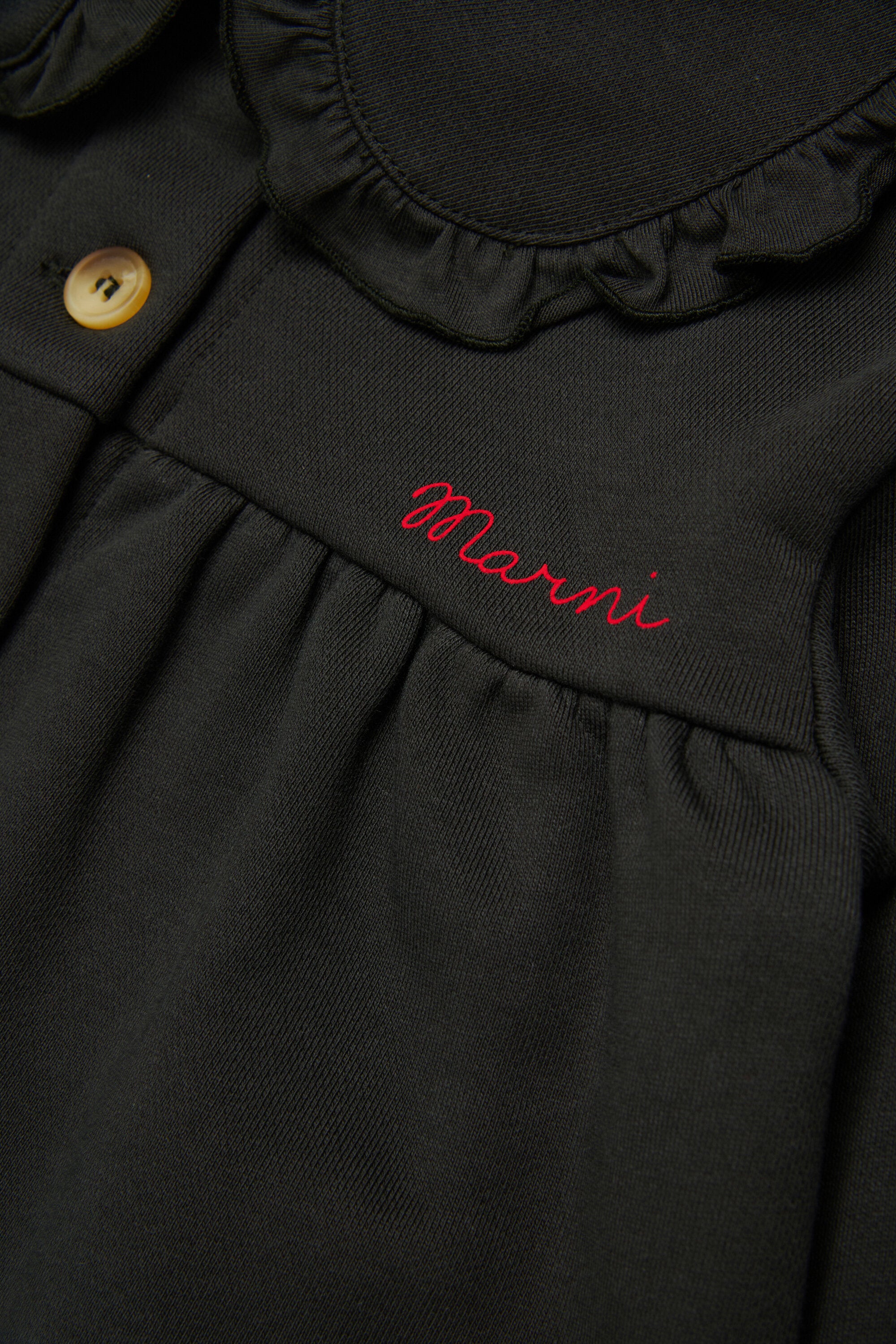 Jacket with logo and ruffles