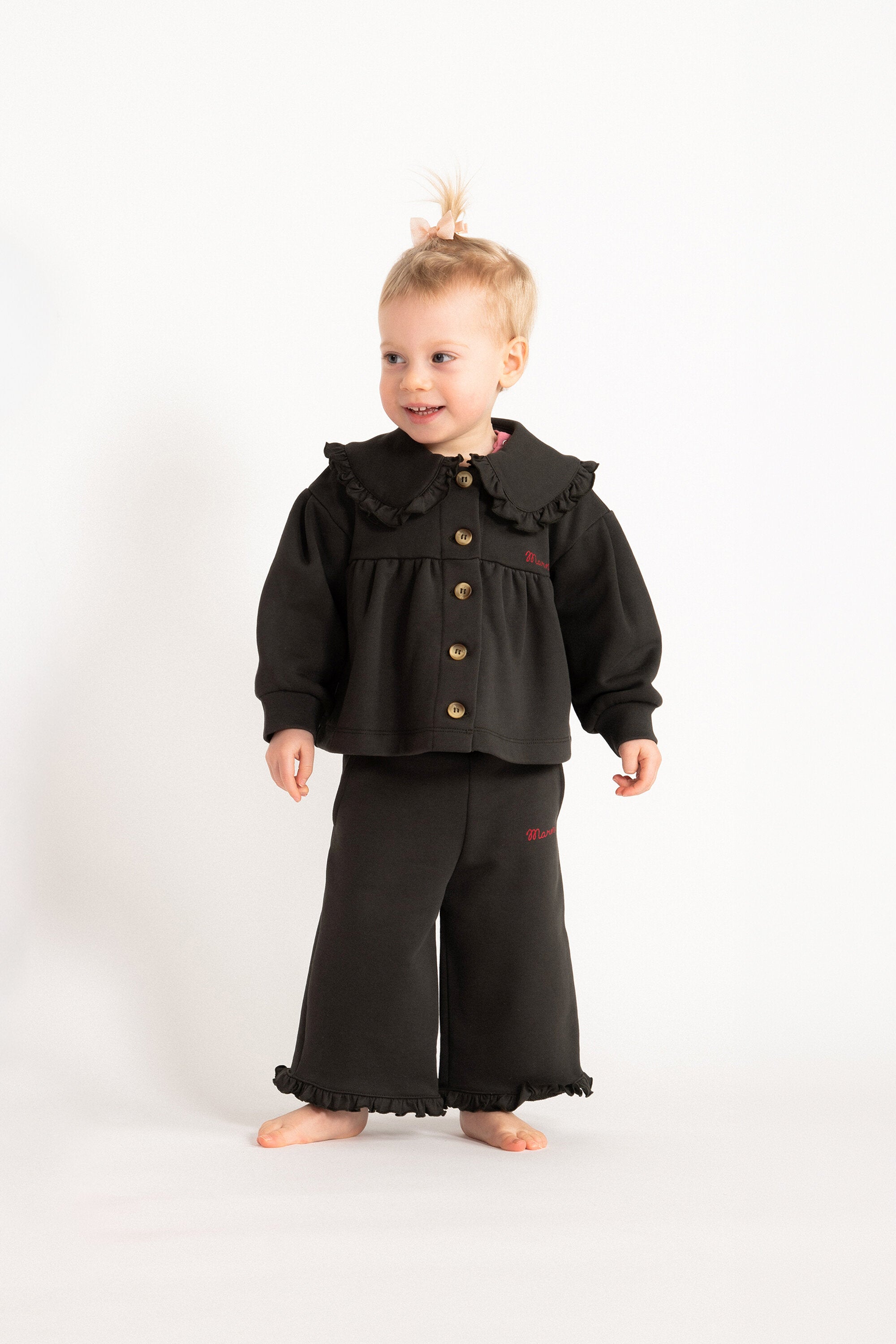 Jacket with logo and ruffles