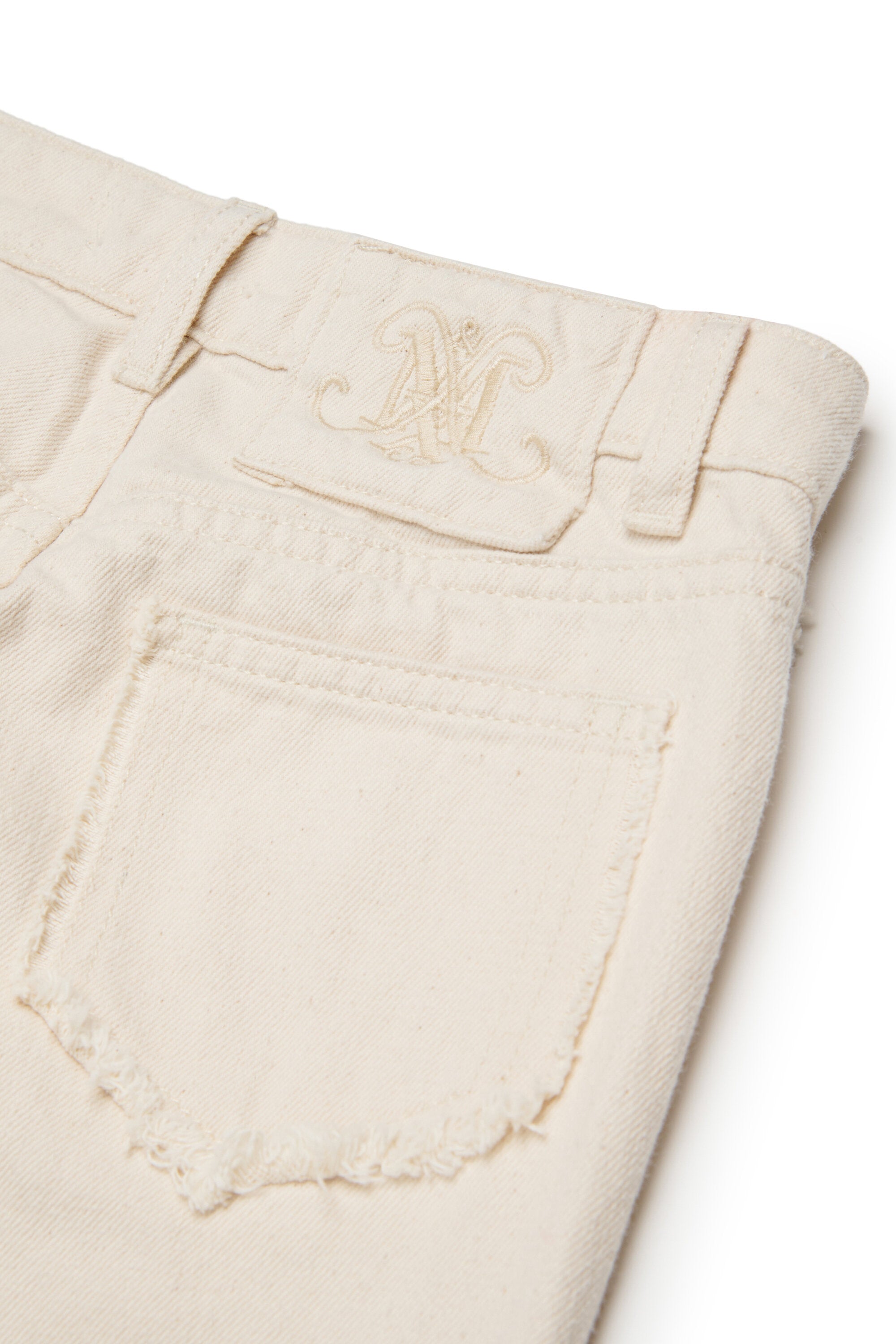 Flare jeans with raw cut details